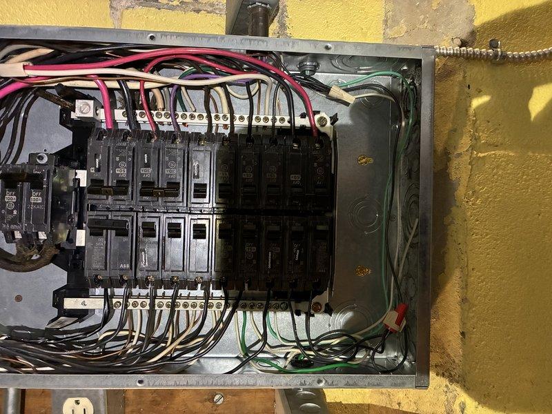 # Electrical Service - No Power

Responded to no-power call at 80-year-old residence where customer reported melted insulation on multiple breakers. Upon arrival, performed comprehensive inspection of main electrical panel and discovered evidence of overheating on several circuit breakers, with visible heat damage to wire insulation and breaker housings. 

Identified primary issues as aged breakers with deteriorated internal contacts causing excessive resistance and heat buildup, along with loose bus bar connections contributing to poor electrical contact. Several breakers showed signs of thermal stress with discolored plastic housings and compromised wire insulation at connection points. The panel itself exhibited wear consistent with its age, including oxidation on bus bars and degraded wire connections throughout.

Disconnected power at main disconnect and verified de-energization before proceeding with repairs. Removed all damaged breakers and replaced with new circuit breakers mee