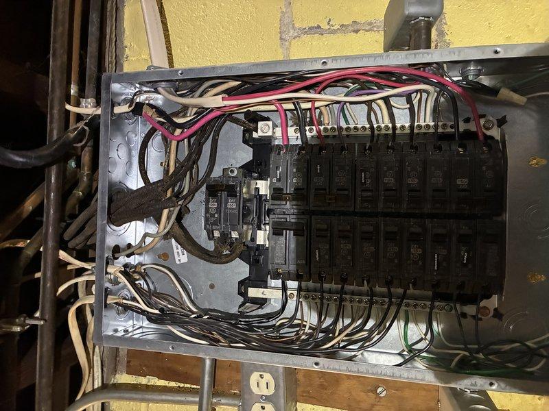 # Electrical Service - No Power

Responded to no-power call at 80-year-old residence where customer reported melted insulation on multiple breakers. Upon arrival, performed comprehensive inspection of main electrical panel and discovered evidence of overheating on several circuit breakers, with visible heat damage to wire insulation and breaker housings. 

Identified primary issues as aged breakers with deteriorated internal contacts causing excessive resistance and heat buildup, along with loose bus bar connections contributing to poor electrical contact. Several breakers showed signs of thermal stress with discolored plastic housings and compromised wire insulation at connection points. The panel itself exhibited wear consistent with its age, including oxidation on bus bars and degraded wire connections throughout.

Disconnected power at main disconnect and verified de-energization before proceeding with repairs. Removed all damaged breakers and replaced with new circuit breakers mee