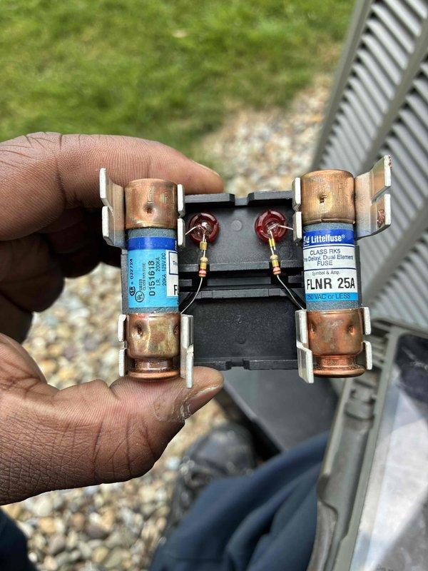Completed preventive maintenance cooling visit on HVAC system. Performed electrical diagnostics using clamp meter, recording 20.0A current draw and 237.2V supply voltage at contactor. Inspected and replaced dual fuse assembly containing GE and Littelfuse FLNR 25A Class RK5 fuses to ensure proper overcurrent protection for system operation.