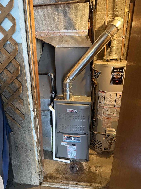 Completed full HVAC system installation including 80% efficiency furnace and air conditioning unit. Installed new Lennox furnace with proper venting, electrical connections including 25A fuse protection, and integrated the system with existing ductwork in the mechanical room. All equipment tested and verified operational upon completion.