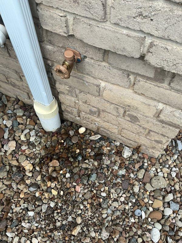 Responded to callback for exterior hose bib experiencing water leakage and spraying issues approximately 8 months after initial installation. Upon arrival, inspected the frost-free outdoor spigot mounted to brick exterior wall and identified failure causing uncontrolled water discharge. Performed diagnostic evaluation of the copper fitting assembly and associated connections. Addressed the defective component under warranty coverage, resolving the water spray condition and restoring proper function to the outdoor water supply fixture.