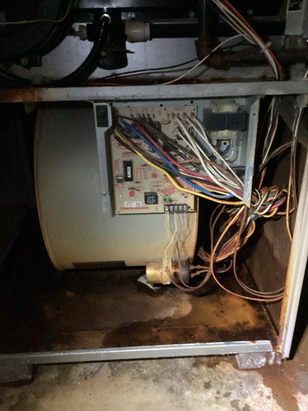 Completed MVP recurring cooling maintenance visit on 23-year-old residential HVAC system. Performed comprehensive inspection of indoor air handler unit, examining blower motor assembly, control board connections, and electrical wiring. Verified all wire terminations secure at control board with proper color-coded connections intact. Inspected outdoor condenser unit positioned on concrete pad, confirmed unit operational with adequate clearance from landscaping. Documented equipment condition through photographic records showing internal components and exterior installation. System operating within normal parameters for unit age.