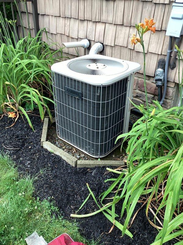 Completed MVP recurring cooling maintenance visit on 23-year-old residential HVAC system. Performed comprehensive inspection of indoor air handler unit, examining blower motor assembly, control board connections, and electrical wiring. Verified all wire terminations secure at control board with proper color-coded connections intact. Inspected outdoor condenser unit positioned on concrete pad, confirmed unit operational with adequate clearance from landscaping. Documented equipment condition through photographic records showing internal components and exterior installation. System operating within normal parameters for unit age.