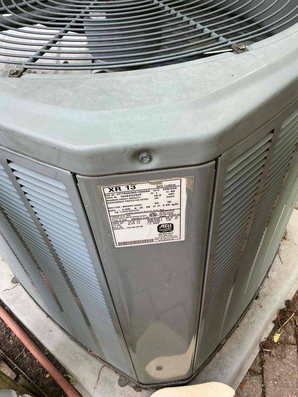 Conducted comprehensive assessment of existing 16-year-old HVAC system including Carrier XR13 condensing unit and gas furnace with blower assembly for replacement estimate. Both units showing signs of age-related wear and weathering, with outdoor condenser exhibiting surface discoloration and indoor equipment displaying typical operational wear patterns. Documented existing system configuration including refrigerant line routing, PVC condensate drainage, electrical connections, and ductwork integration to provide accurate replacement specifications and ensure proper sizing for new equipment installation.