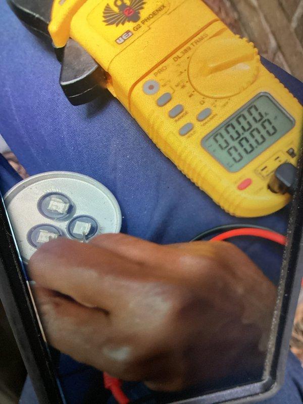 Responded to no cooling complaint on three-year-old Lennox outdoor condenser unit. Upon arrival, performed diagnostic testing using digital multimeter to measure electrical values and system operation. Unit exterior showed normal weathering and accumulated outdoor debris on fan guard and top cap. Diagnostic measurements indicated system required further electrical troubleshooting to identify root cause of cooling failure affecting entire home.