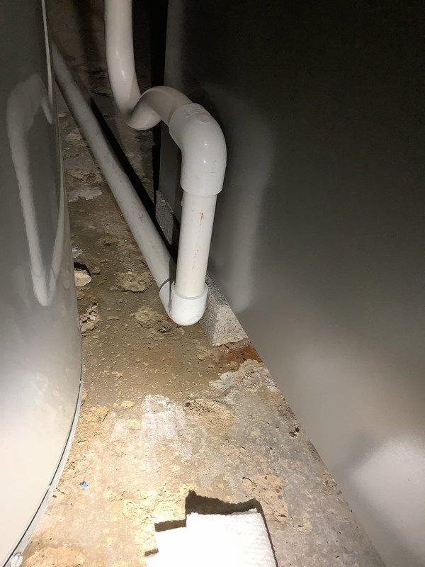 Responded to service call for AC drain line issue in residential property with recently installed HVAC system. Upon inspection of basement mechanical room, identified problem with condensate drain line routing from air handler unit to existing sump pump system. The drain line had developed improper pitch and potential blockage points where PVC connections joined. Cleared obstruction from drain line, verified proper drainage flow, and ensured condensate was discharging correctly into sump pump basin. Tested system operation to confirm AC unit draining properly without backup or overflow concerns.