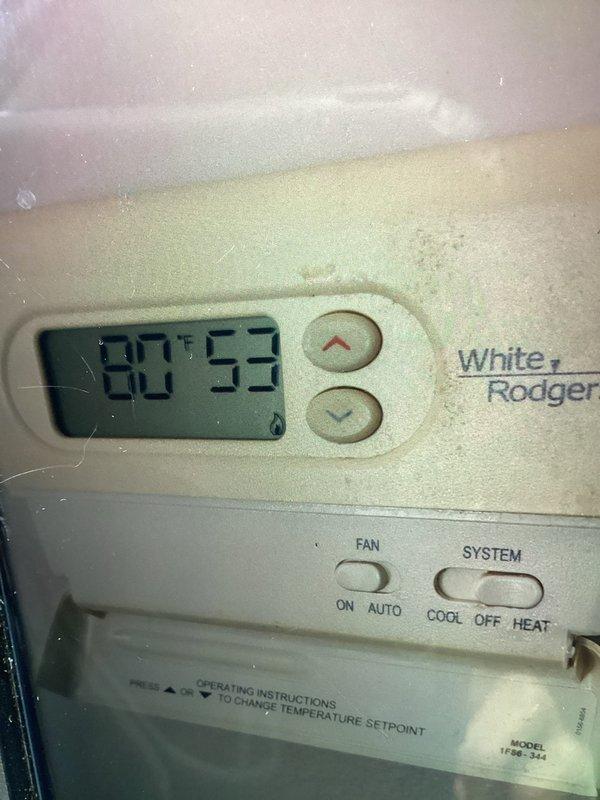 Responded to emergency no-cool call for residential central air conditioning system affecting entire home. Upon arrival, found White-Rodgers thermostat displaying 90°F indoor temperature with system set to cool mode. Inspected outdoor condenser unit and verified equipment operation. Photographed thermostat settings and outdoor unit condition for service documentation. System restored to normal cooling operation.