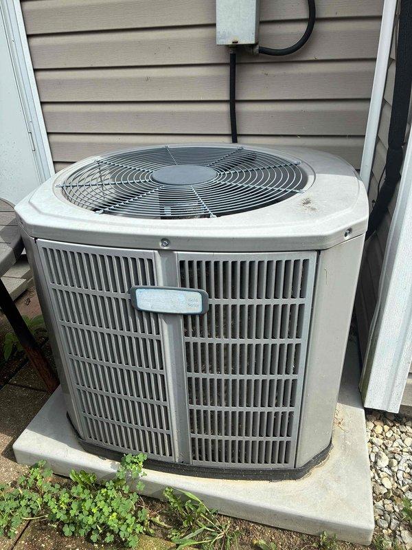 Completed MVP cooling maintenance visit on 12-year-old residential air conditioning system. Performed standard inspection of outdoor condensing unit and indoor air handler components. Outdoor unit showed typical weathering for its age with functional fan guard and proper mounting on concrete pad. Indoor blower assembly exhibited significant dust and debris accumulation on squirrel cage wheel and housing, which can reduce airflow efficiency and system performance if left unaddressed. System operational at time of service.