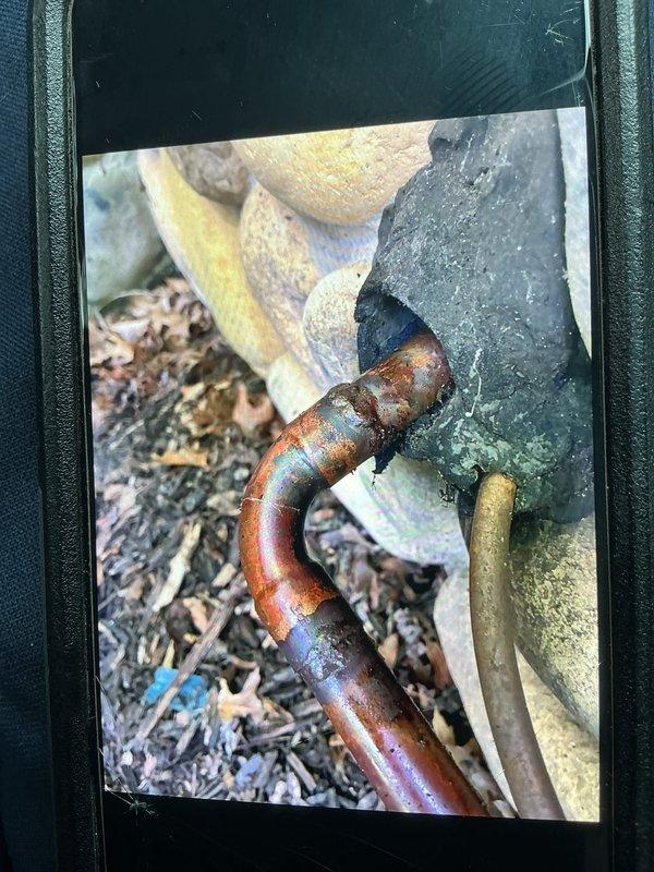 Performed leak search on HVAC system and identified corroded copper refrigerant line requiring replacement. Located compromised section of piping with significant oxidation and deterioration of insulation material. Replaced damaged copper line section with truck stock materials and pressure tested system to verify repair integrity.