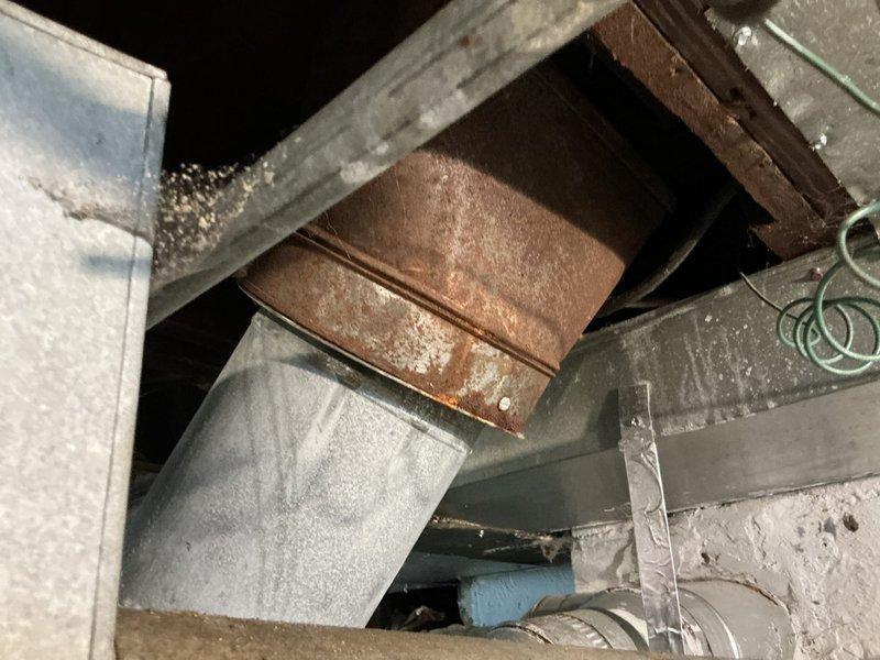 Conducted site evaluation for mini split installation as alternative to existing ductwork system. Inspected attic space and assessed current HVAC infrastructure, including rectangular metal ductwork with brown transition damper and mechanical components. Documented existing conditions showing dust accumulation and confined workspace typical of attic installations. Evaluated interior space and floor conditions where indoor unit would be mounted. Provided estimate for mini split system installation to address customer's heating and cooling needs without requiring ductwork modifications.
