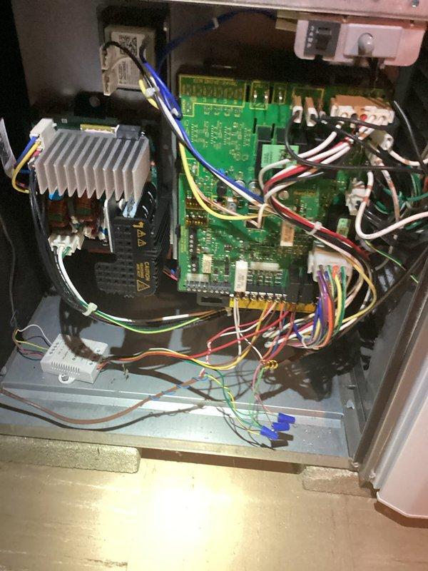 # No Cool Service - Residential HVAC System

Responded to service call for complete loss of power to thermostat (Model S86NMU) following overnight power outage. Upon arrival, confirmed no display or power at thermostat location. Inspected Lennox furnace system and associated control board in basement utility room. 

Traced electrical circuits from thermostat through low-voltage wiring to furnace control panel. Opened furnace control panel and visually inspected green control board for signs of power surge damage, including burned components, damaged traces, or failed transformers. Checked all wire connections at control board terminals for secure attachment and proper seating in white connector blocks.

Tested 24VAC transformer output and verified proper voltage supply to control circuit. Examined heat sink assembly and power components on left side of control board for thermal damage or failure. Inspected all colored wire bundles (blue, yellow, red, white, black) for continuity and pr