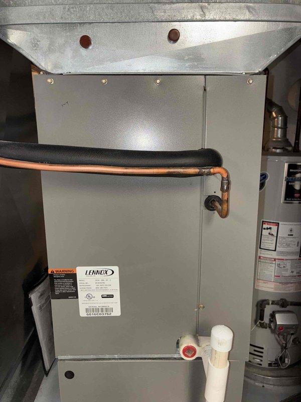 Completed MVP preventative maintenance cooling visit on 10-year-old Lennox system. Inspected indoor air handler unit, which showed good overall condition with clean cabinetry, properly insulated refrigerant lines, and functional condensate drainage. Outdoor condensing unit exhibited heavy dirt and debris accumulation on exterior surfaces and condenser coils, requiring thorough cleaning to restore proper airflow and heat transfer efficiency. Cleaned condenser coils, cleared debris from unit base, and verified proper refrigerant line connections and electrical conduit routing. System operational upon completion.