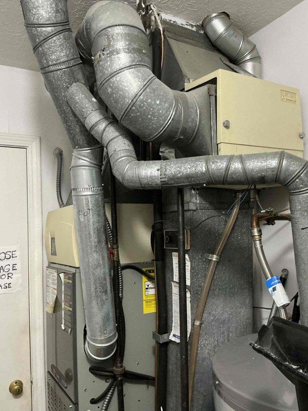 Conducted comprehensive HVAC system evaluation for 19-year-old R22 air conditioning system replacement estimate. Assessed existing mechanical room installation including air handler unit, ductwork configuration, and overall system condition, documenting equipment age and refrigerant type for replacement specifications. Provided detailed quote for complete system replacement due to obsolete R22 refrigerant and equipment age exceeding typical service life.