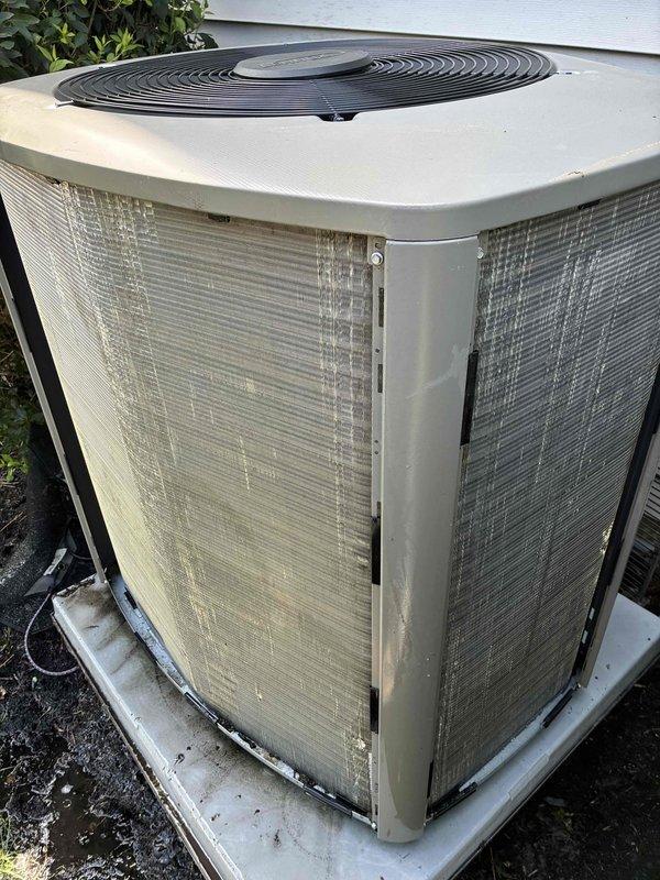 Completed MVP cooling maintenance visit on 4-year-old system. Performed comprehensive inspection of outdoor condensing unit, noting weathering and dirt accumulation on exterior panels and grilles consistent with normal outdoor exposure. Verified temperature readings at indoor air handler in attic space, measuring 70.7°F supply air temperature. Confirmed unit operational with proper airflow through condenser coils despite surface debris. System functioning within normal parameters for routine preventive maintenance service.