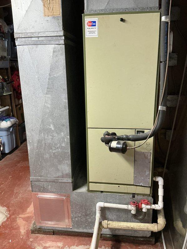 Performed comprehensive assessment of existing HVAC system for replacement estimate. Evaluated 45-year-old furnace and 30-year-old air conditioning unit currently serving residential property. Documented existing equipment conditions, photographed furnace installation in basement utility area including ductwork configuration, existing plumbing connections with PVC and copper piping, and current system layout. Provided detailed replacement recommendations and equipment options to customer for complete system upgrade.