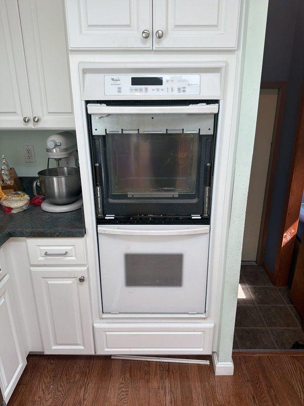 Disconnected and removed a white Whirlpool double wall oven unit from kitchen cabinetry. De-energized the 240V circuit supplying the appliance, verified power disconnection, and properly capped all electrical conductors in the wall cavity per code requirements. Troubleshot and repaired multiple non-functioning outlets throughout the residence, identifying loose connections at terminal screws and restoring power to all affected receptacles.