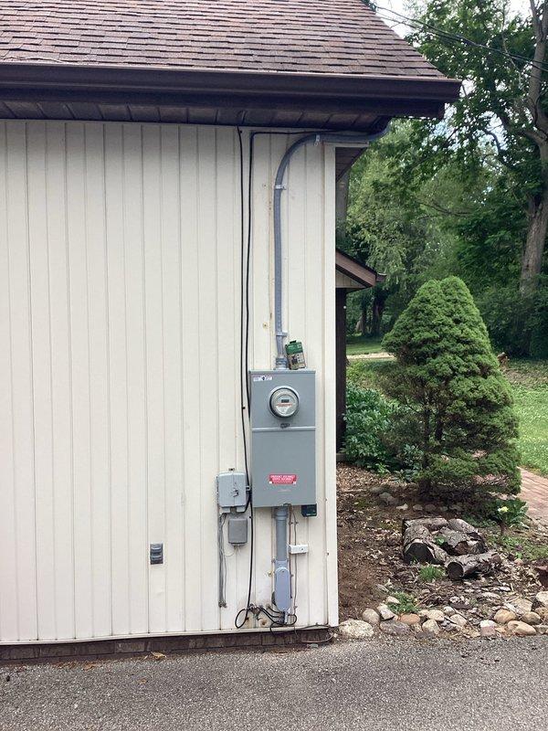 Completed a comprehensive 200-amp electrical service upgrade with full compliance to 2023 National Electrical Code requirements. Installed new exterior disconnect switch, upgraded main service panel, and integrated whole-home surge protection system. All necessary code updates were implemented, including proper grounding, bonding, and weatherhead installation with exterior-grade conduit and meter assembly mounted on residential siding.