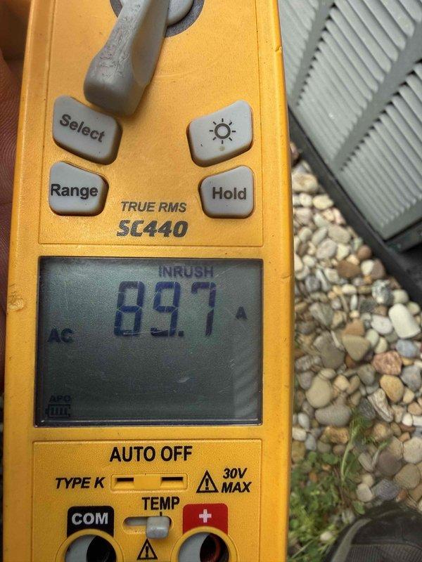 Completed MVP cooling maintenance visit on 10-12 year old HVAC system. Performed comprehensive system inspection with access panel removed to evaluate internal components including control board, capacitors, blower motor assembly, and electrical connections. All wiring verified secure with proper color-coded connections and zip tie management in place. Conducted electrical diagnostics using digital multimeter, recording 89.7 AC inrush current reading to assess compressor and motor performance. Control board, transformer, and all internal components found operating within normal parameters with no signs of deterioration or failure.