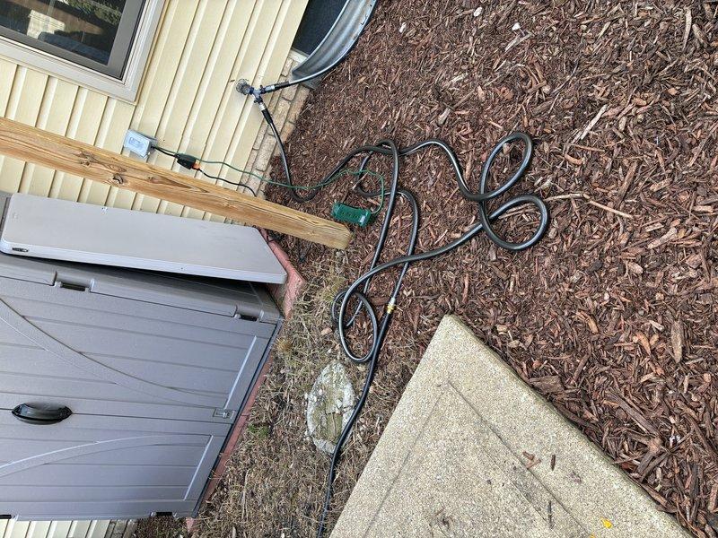 Installed two exterior GFCI-protected outlets with underground wiring runs. Excavated and trenched approximately 15 feet from the main residence and 10 feet from the detached shop building, routing direct burial cable through conduit to each new outlet location. Added dedicated circuit breakers to the electrical panel and completed all connections per NEC standards for outdoor receptacles.