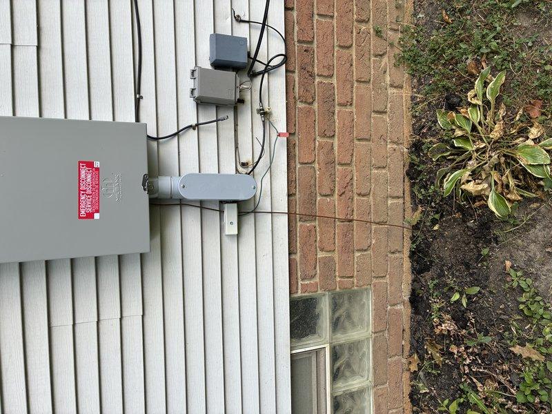 Responded to callback for improperly buried ground wire at exterior electrical service installation. Previous technicians had installed ground wire below grade, but wire had since become exposed above ground level. Properly buried ground wire according to NEC requirements to protect conductor from physical damage and ensure code compliance. Verified all exterior electrical connections at meter panel and associated conduit runs remained secure and weatherproof upon completion of burial work.