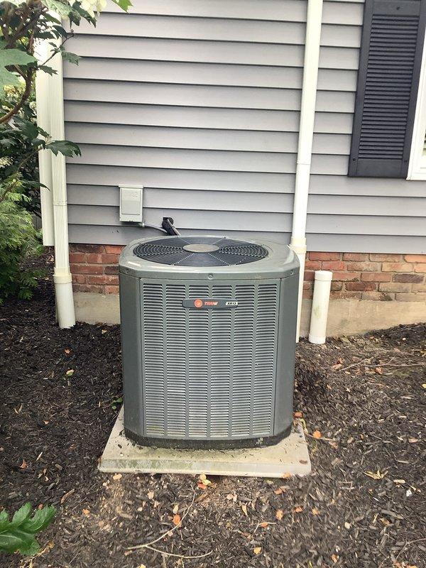 Completed installation of air conditioning condenser unit and evaporator coil system as secondary installation. Positioned outdoor condenser unit on concrete pad against exterior wall with proper clearances, established refrigerant line connections, and verified electrical connections to disconnect box. Indoor evaporator coil integrated with existing furnace system in mechanical room, with condensate drain lines properly routed to existing plumbing infrastructure.