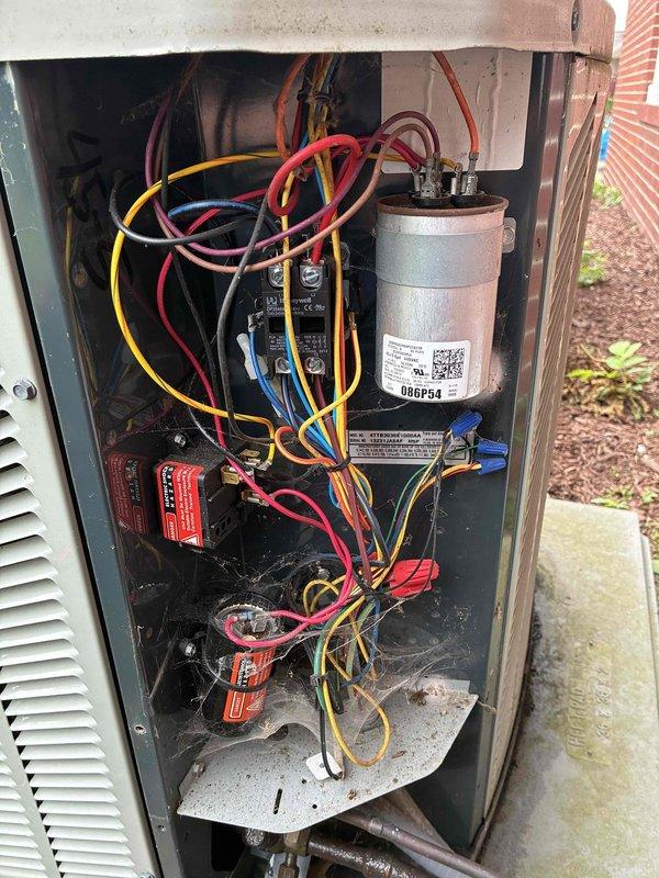 Completed scheduled preventive maintenance visit on 12-year-old residential air conditioning system. Performed comprehensive system inspection including electrical component examination, capacitor condition assessment, and temperature diagnostics. Verified proper operation of outdoor condensing unit, checked all electrical connections and wiring integrity, and confirmed system cooling performance with digital temperature measurements at supply registers reading 73°F. All components found to be functioning within normal operating parameters with no immediate repairs required.