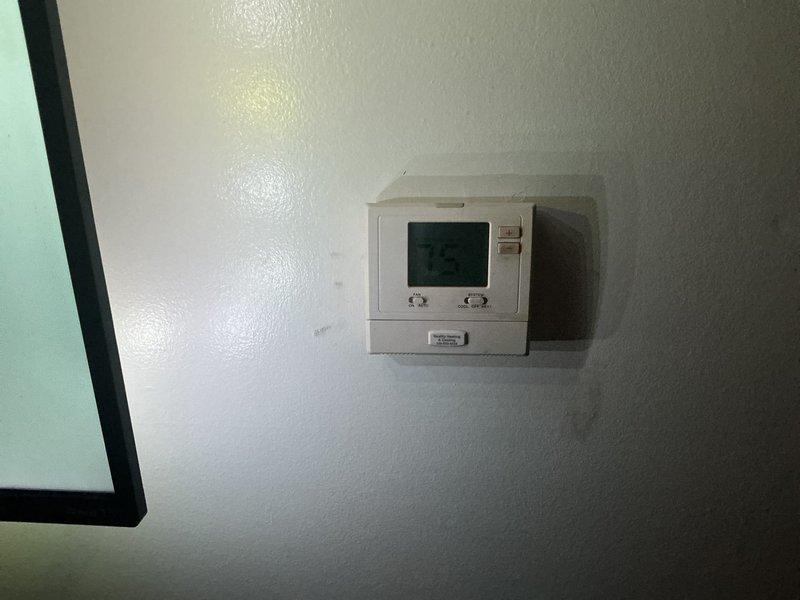 Provided estimate for complete air conditioning system replacement on 31-year-old unit with over $1,600 in quoted repairs. Coordinated with property owner remotely and confirmed appointment with tenant for system replacement consultation. Documented existing Bryant furnace installation and current thermostat configuration for replacement planning.