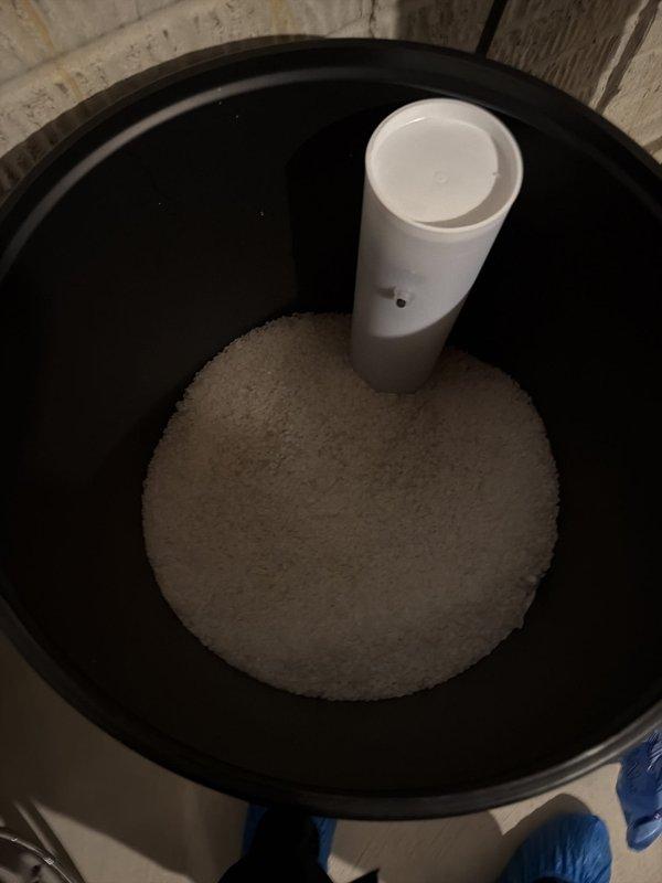 Responded to service call for recently installed water softener that was not functioning properly with no indicator lights operational. Diagnosed system issue, performed necessary adjustments to restore proper operation of the control unit and display. Added four bags of salt to the brine tank to establish proper regeneration cycle and ensure adequate sodium chloride levels for effective water softening. Verified all plumbing connections, tested system functionality, and confirmed control head was properly programmed and operational with display lights now active.