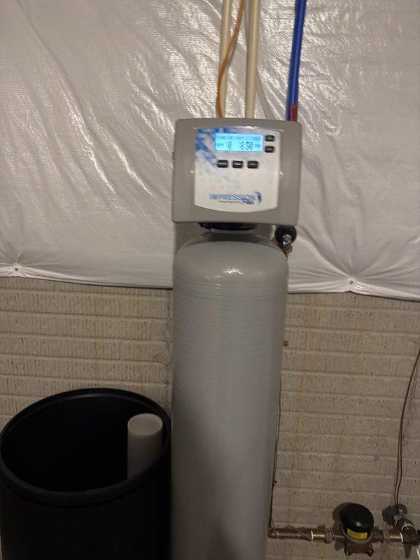 Responded to service call for recently installed water softener that was not functioning properly with no indicator lights operational. Diagnosed system issue, performed necessary adjustments to restore proper operation of the control unit and display. Added four bags of salt to the brine tank to establish proper regeneration cycle and ensure adequate sodium chloride levels for effective water softening. Verified all plumbing connections, tested system functionality, and confirmed control head was properly programmed and operational with display lights now active.