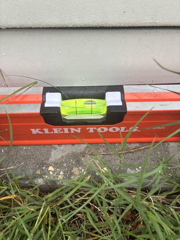 Responded to service call for unlevel generator installation. Upon arrival, confirmed generator unit was significantly out of level using precision measuring tools. Coordinated two-person crew and obtained two totes of gravel from warehouse as required materials. Successfully re-leveled generator unit to manufacturer specifications by adjusting base support with gravel fill material beneath concrete pad. Verified proper leveling with spirit level to ensure optimal equipment operation and longevity. Unit now meets installation standards for safe and efficient performance.