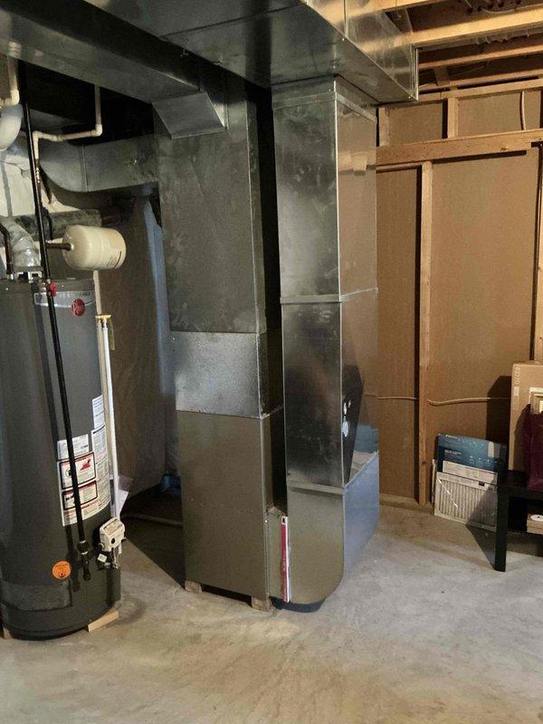 Completed estimate for replacement of residential air conditioning system. Existing outdoor condenser unit is 15+ years old and mounted on exterior wall with metal brackets, connected to indoor furnace system located in basement. Evaluated current HVAC configuration including electrical disconnect, conduit routing, and ductwork connections to provide replacement options for aging cooling system.