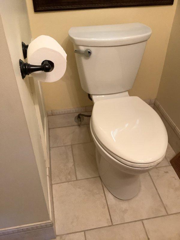 Replaced existing one-piece toilets with Cadet Pro elongated bowl two-piece models per customer request. Completed installation of remaining toilet in bathroom that had been previously delayed due to required floor repairs beneath the fixture. All replacement fixtures installed with new water supply connections, wax ring seals, and proper mounting hardware to ensure code-compliant operation.