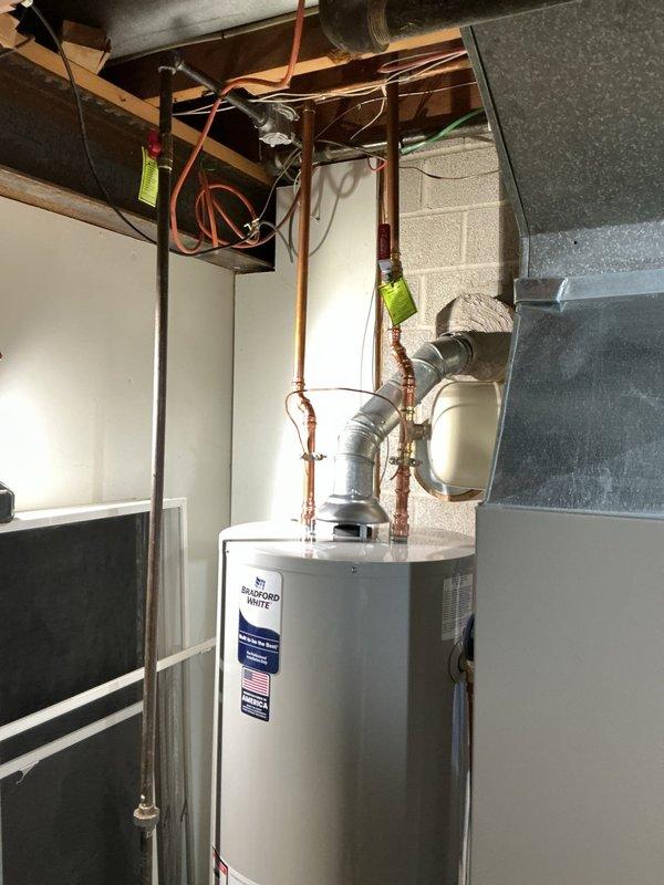 Replaced 40-gallon tall Bradford White water heater under manufacturer warranty coverage. The existing unit remained under warranty through 2027, with the tank replacement covered by warranty while labor and additional materials were provided separately. Installed new water heater with proper connections to existing copper plumbing lines, ensuring all piping, fittings, and circulation pump were correctly integrated. Verified all connections for proper operation and system functionality upon completion.