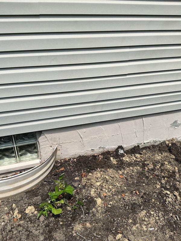 Installed new outdoor hose spigot on exterior wall of residence. Ran water supply line through foundation, mounted frost-free sillcock to vinyl siding with appropriate backing and weatherproof seal, and tested for proper operation and leak-free connections.
