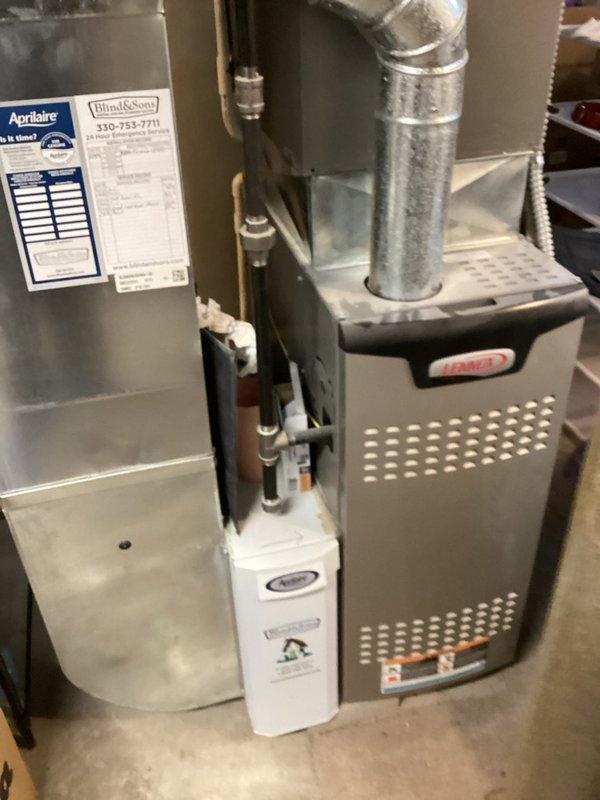 Performed scheduled maintenance visit for MVP customer's air conditioning system. Upon inspection, found outdoor condenser coil heavily clogged with dirt, dust, and debris, significantly restricting airflow and reducing system efficiency. Cleaned condenser coil fins thoroughly to remove accumulated buildup and restore proper airflow. Inspected indoor air handler unit and associated components, including humidifier and ductwork connections, confirming all equipment is in functional and well-maintained condition with no visible damage or deterioration.