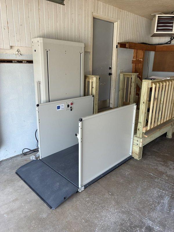 Installed dedicated electrical outlet in garage for vertical platform lift (VPL). Ran conduit and wiring to provide power supply, ensuring proper circuit protection and code compliance for wheelchair accessibility equipment operation.