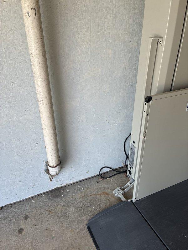 Installed dedicated electrical outlet in garage for vertical platform lift (VPL). Ran conduit and wiring to provide power supply, ensuring proper circuit protection and code compliance for wheelchair accessibility equipment operation.