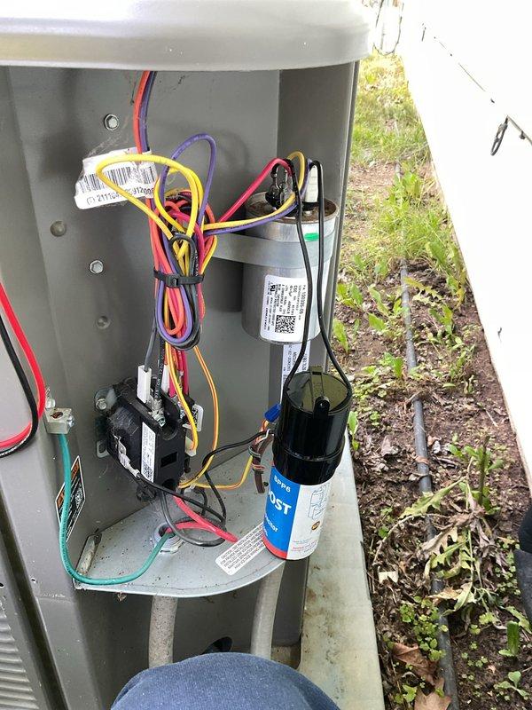 # HVAC Service - A/C

Responded to service call for outdoor condensing unit experiencing intermittent power cycling and unusual noise during operation. Upon arrival, confirmed unit was shutting down approximately 3 seconds after startup while condenser fan attempted to run. Opened electrical service disconnect panel and inspected internal components. Identified failed dual-run capacitor as primary cause of short cycling and abnormal operational sounds. Capacitor showed signs of electrical failure preventing proper motor startup for both compressor and fan motor. Replaced defective capacitor with new unit matching manufacturer specifications. Verified all electrical connections were secure, tested system operation, and confirmed unit now runs continuously without noise or power interruptions. System restored to normal operating condition.