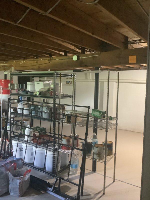 Conducted on-site assessment for complete HVAC system installation in older residential property with no existing heating or cooling infrastructure. Evaluated interior living spaces and basement utility areas to determine optimal equipment placement, ductwork routing through exposed joist spaces, and system sizing requirements for whole-home comfort solution.