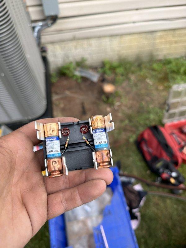 # HVAC Install - Complete System

## Summary
Completed full installation of 80% efficiency furnace and air conditioning system, including all electrical connections, refrigerant lines, and safety components.

## Work Performed

Installed new 80% AFUE gas furnace and matching air conditioning condenser unit. Established all necessary electrical connections using appropriately rated fuses and circuit protection components. Verified proper amperage ratings on all Littelfuse brand fuses and secured connections with metal clips and mounting hardware.

Configured refrigerant line set with copper piping, connecting evaporator coil to outdoor condensing unit. Installed brass service valves with proper safety labeling at connection points. Routed flexible ductwork from furnace plenum to distribution system, ensuring proper sealing and support throughout installation.

Mounted outdoor condenser unit on stable pad with proper clearances from structure. Secured all copper refrigerant lines with ap