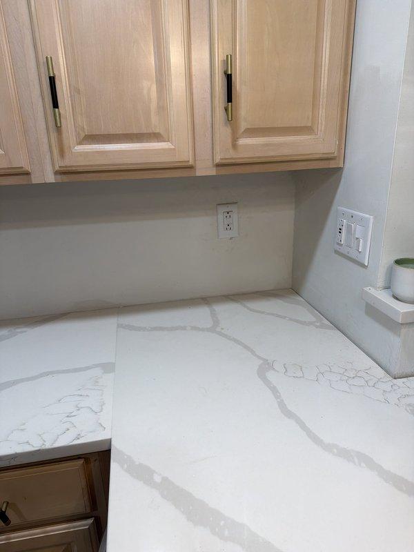Completed installation of two customer-provided pendant light fixtures over kitchen island, replacing existing fixtures. Replaced malfunctioning three-way switch at top of stairway controlling ceiling fan circuit. Installed new duplex receptacle in hallway and new GFCI receptacle on kitchen counter to ensure proper ground fault protection and code compliance.