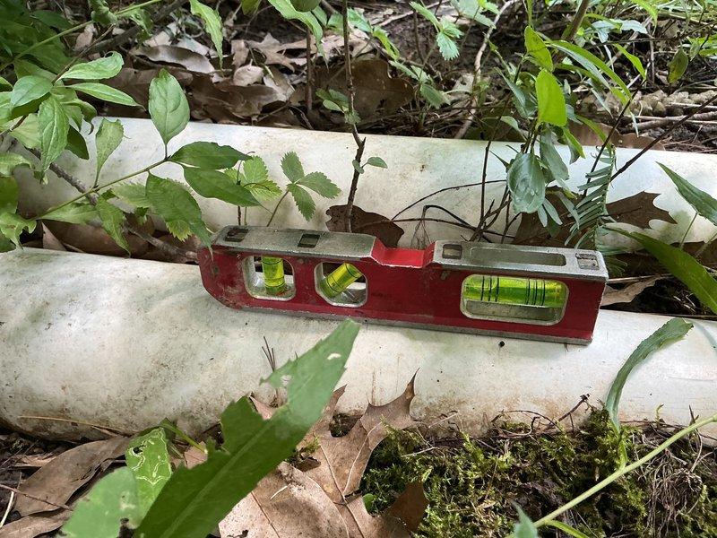 Responded to service call for clogged downspout located near new air conditioning unit. Upon arrival, accessed the drainage system through existing access port and assessed the blockage. Cleared debris and organic material obstructing the downspout flow, ensuring proper water discharge away from the foundation. Verified system functionality and confirmed unobstructed drainage through the PVC discharge line.