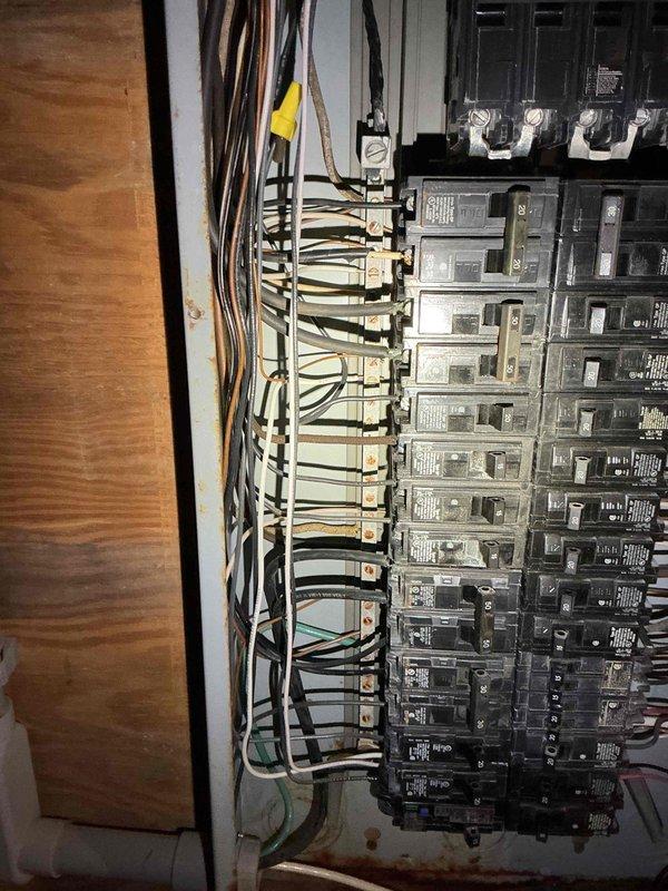Conducted on-site evaluation for whole house generator installation at residential property originally constructed in late 1920s/early 1930s. Assessed existing electrical infrastructure, including main service panel configuration and current capacity. Documented electrical panel interior showing multiple circuit breakers with organized wire routing. Evaluated compatibility of existing electrical system with proposed generator installation requirements. Property currently utilizes oil heating system, which was factored into load calculations and transfer switch specifications. Photographed panel configuration to support estimate development for automatic transfer switch installation and necessary electrical upgrades to accommodate standby generator system.