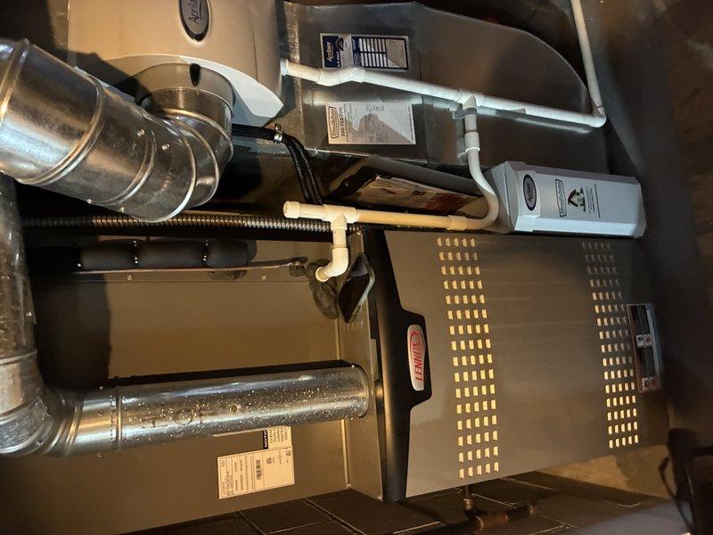 Completed preventive maintenance tune-up on 3-year-old Lennox air conditioning system. Inspected blower assembly and squirrel cage fan, confirming clean blades and proper operation. Verified all system components, ductwork connections, and furnace unit are functioning within normal parameters.