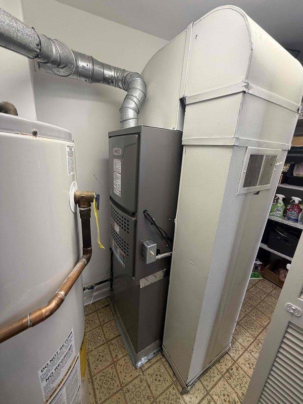 Completed full HVAC system installation in residential utility closet, including downflow 80% efficiency gas furnace and air conditioning system. Installed new furnace unit with proper venting configuration, connected metallic ductwork and supply plenum to existing distribution network, and established all necessary gas line connections using flexible connector. Configured system for downflow application to match existing infrastructure layout. All equipment secured, tested for proper operation, and left in full working condition.