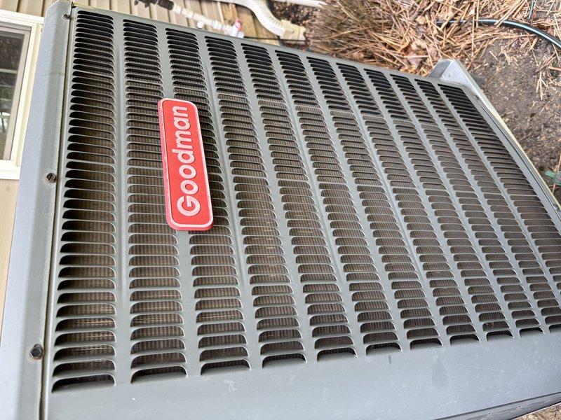 Responded to callback for incomplete A/C tune-up service where outdoor condenser unit was not properly cleaned during previous maintenance visit. Upon arrival, inspected Goodman brand air conditioning condenser and confirmed visible accumulation of dirt and debris on top grille and louvered panels. Performed thorough cleaning of condenser unit exterior, removed debris from grille slats, and inspected electrical connections including contactor assembly and terminal block. Verified all wire connections were secure and system operational following completion of maintenance tasks that were missed during initial service call.