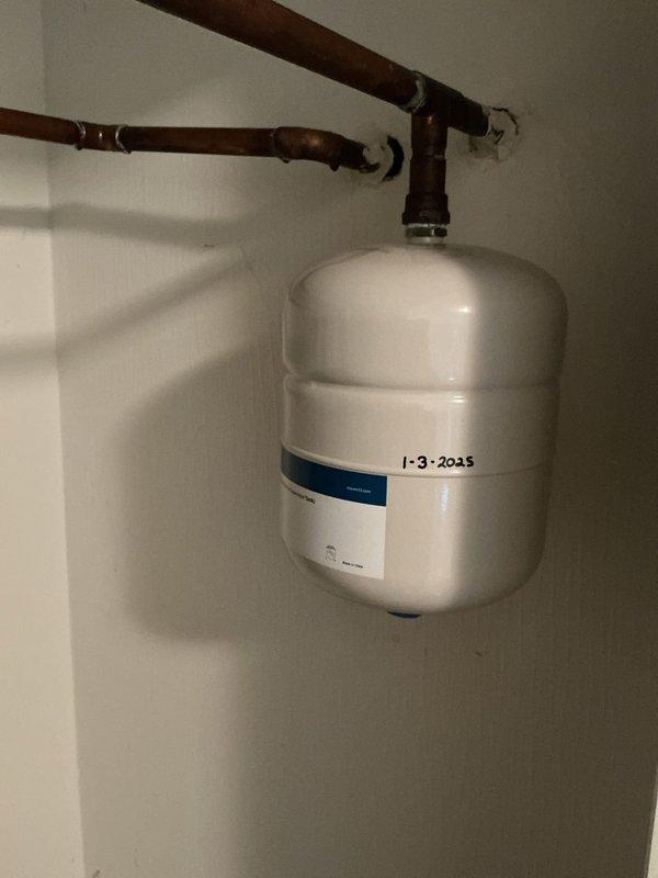 Performed complete flush and fill service on an 11-year-old tanked water heater system. Drained sediment buildup from tank, flushed unit thoroughly to remove mineral deposits and debris, and refilled system. Inspected expansion tank, pressure relief valve, and associated copper piping connections during service. All components functioning properly upon completion, with system restored to normal operating condition.