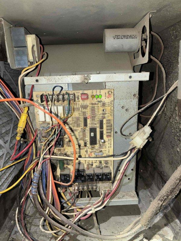 Completed scheduled MVP cooling maintenance visit between 8:00-8:30am as rescheduled. Performed comprehensive system inspection including examination of interior air handler components and control board assembly. Inspected circuit board with relays, capacitors, and electrical connections, verifying all wiring terminations and component functionality. Evaluated cylindrical capacitor and associated electrical components for proper operation. Documented system condition with interior ceiling register location and control board assembly photos showing existing dust accumulation on equipment surfaces. System operating within normal parameters at time of service completion.