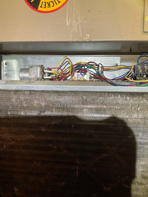 Responded to service call for closet-mounted air conditioning unit not cooling properly with suspected refrigerant issue. Upon inspection, found R22 system with heavily soiled evaporator coil restricting airflow and reducing cooling efficiency. Verified electrical connections at control board and capacitor. Documented existing conditions with photos showing dust and debris accumulation on coil fins and internal components. Enrolled customer in maintenance membership program per request.
