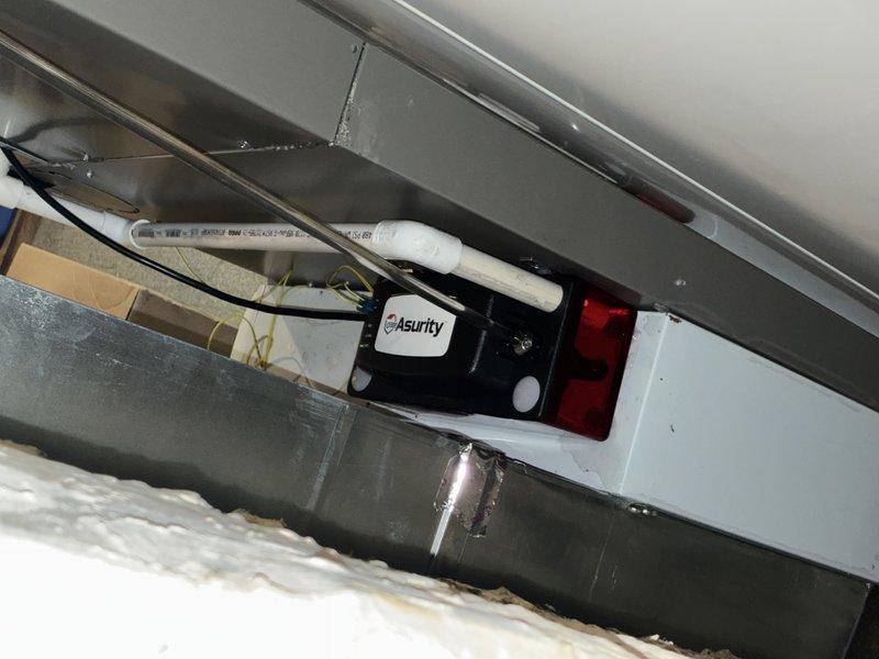 Responded to water leak reported beneath newly installed Lennox furnace system. Upon inspection, discovered condensate drain line issue related to the Asurity control board installation and associated drainage components. Verified proper connection of condensate drainage system, checked drain line routing, and ensured all connections were secure to prevent further water accumulation beneath the unit.